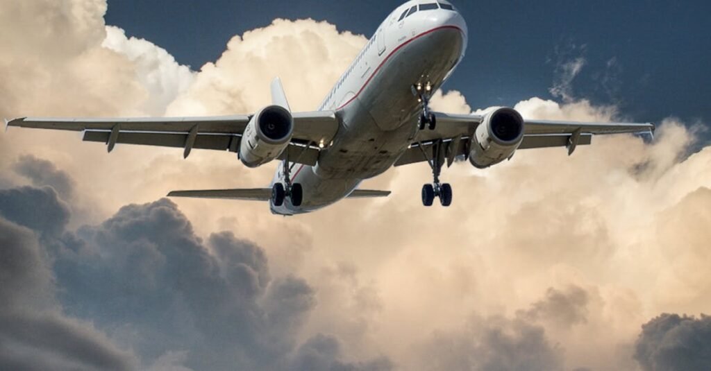 A commercial airplane flying through dramatic clouds, showcasing aviation in action.