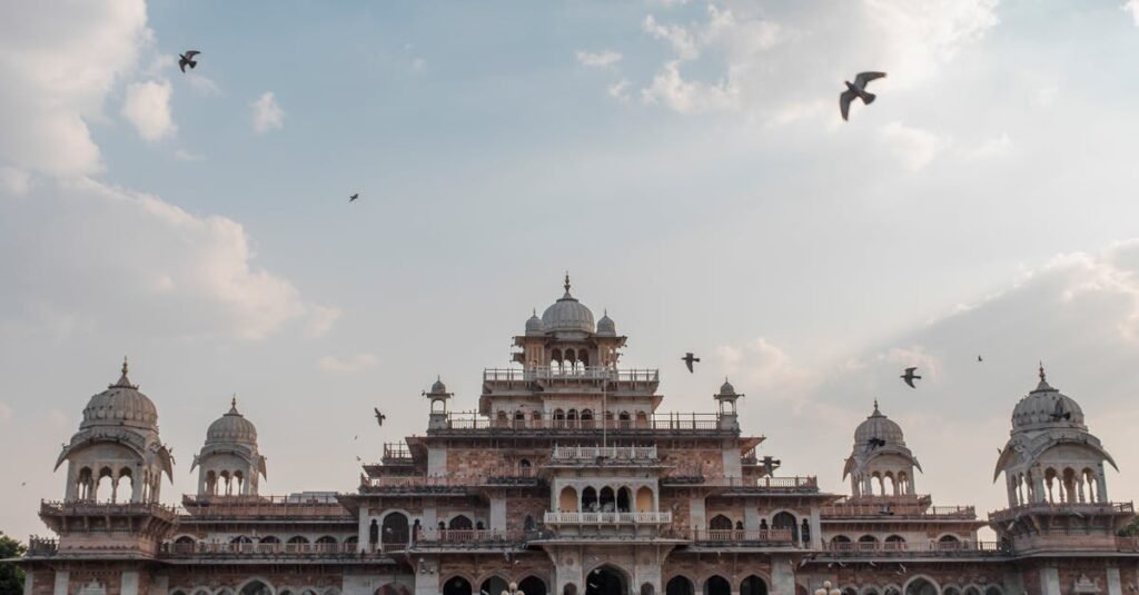 Stunning view of the historic Albert Hall Museum in Jaipur with birds flying above.